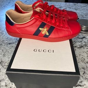 Gucci men's authentic sneakers colors are red, blue and gold size is a 10 1/2.
